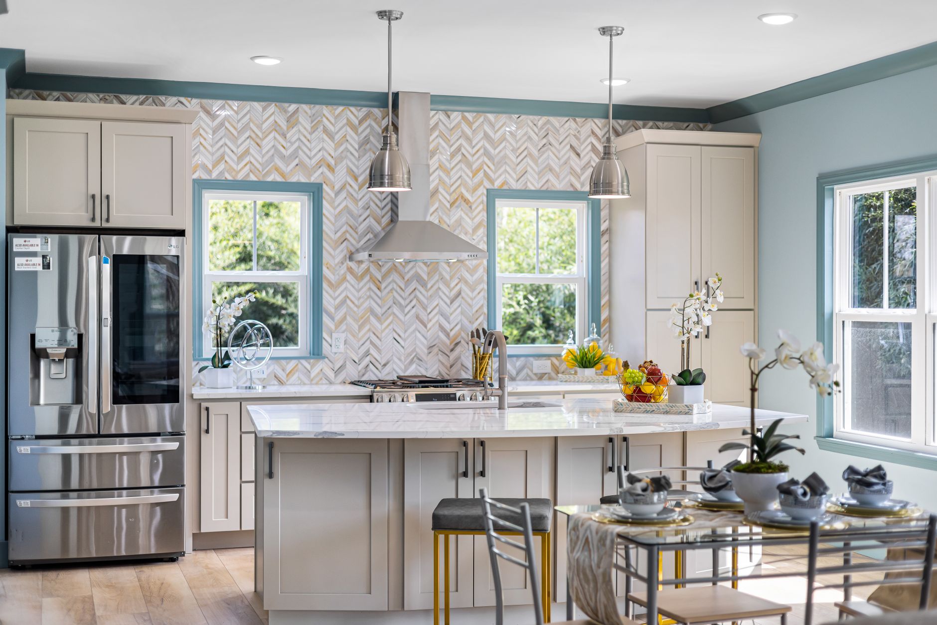 Bright modern kitchen featuring a spacious island and stylish decor, perfect for home interiors